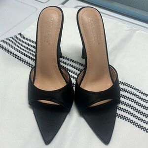 Black open toed heels. In good condition. Size 9..